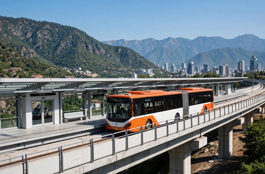 Orange Line metrobus on elevated track near Islamabad with Margalla Hills in the background